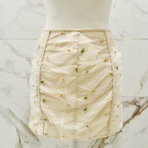 Le Lis Cream Mini Skirt with Floral Accents